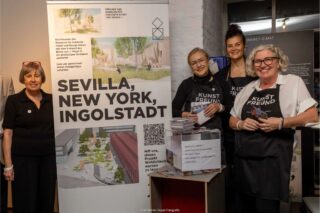 Four women at an information booth for a project organized by the Friends' Association
