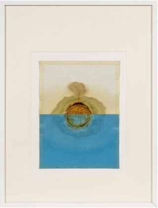A two-tone background, divided down the middle in white and turquoise, featuring an organically decomposed slice of salami in the center of the image.