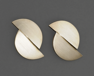Two geometric ear clips shaped like two semicircles.
