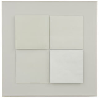 Four white squares beneath a transparent Plexiglas cover.